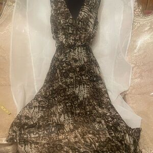 Flowy dress in size Medium. Side zipper closure. New with tags